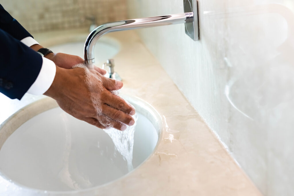 business man washing his hands