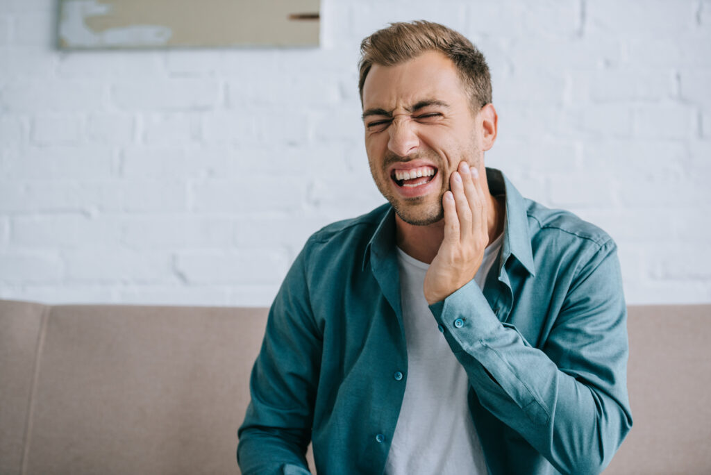 man with jaw pain