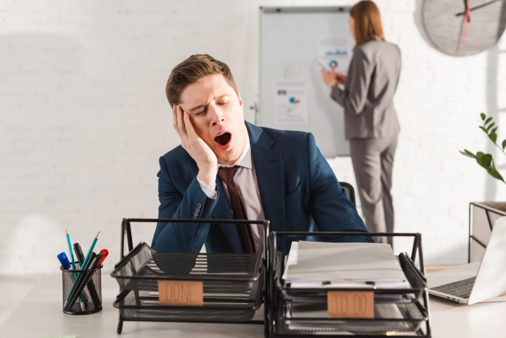 man yawning at work