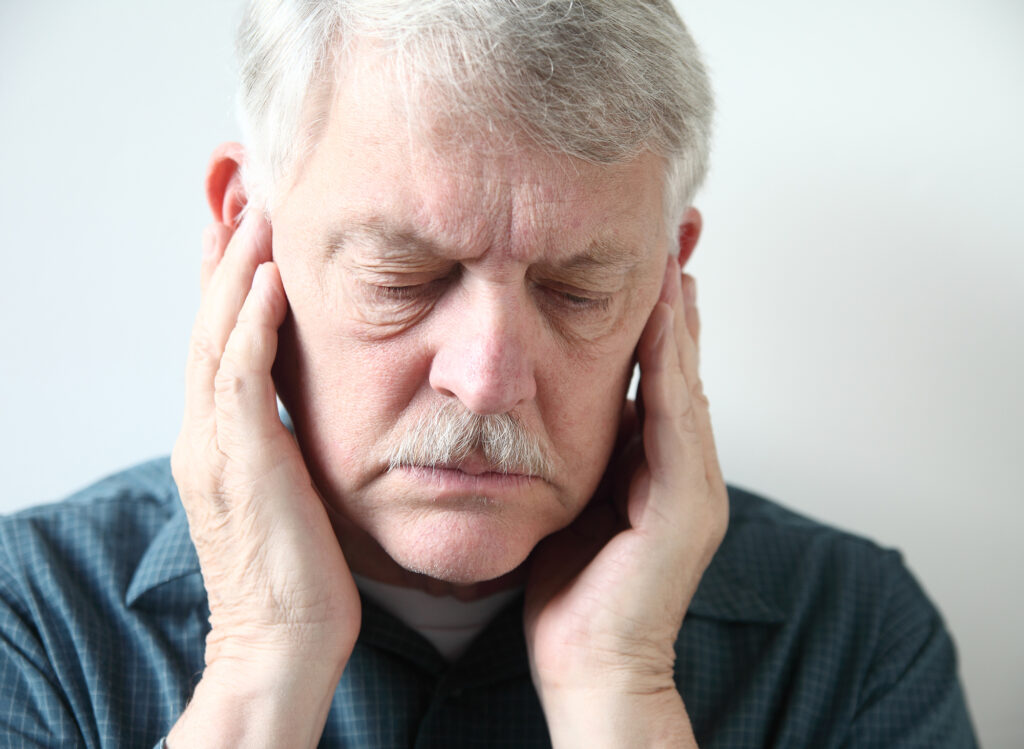 older man with TMJ pain