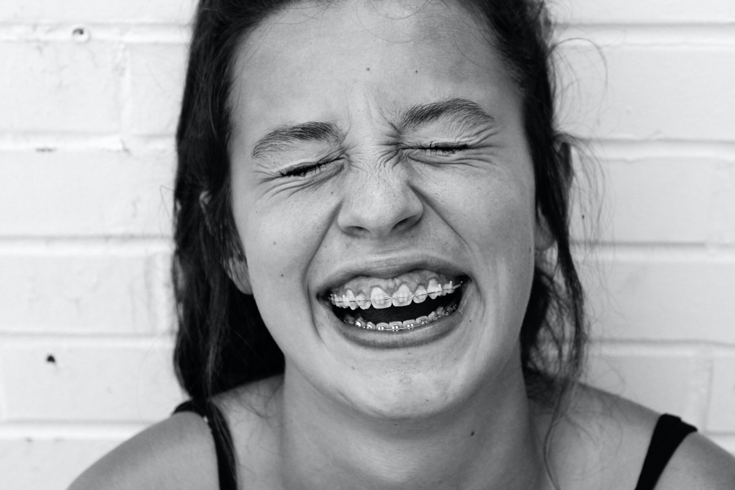 A young girl smiles happily to display her orthodontics for children in Sacramento, CA