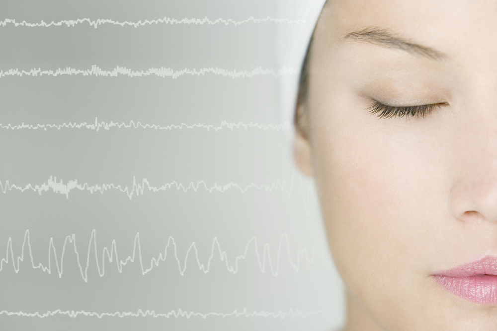 headshot woman with sleep studies report in background